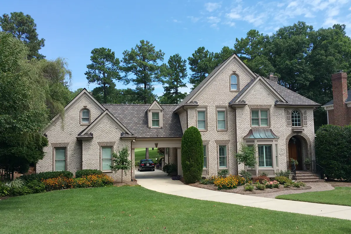 A two-story home with a new Roofwerks roof